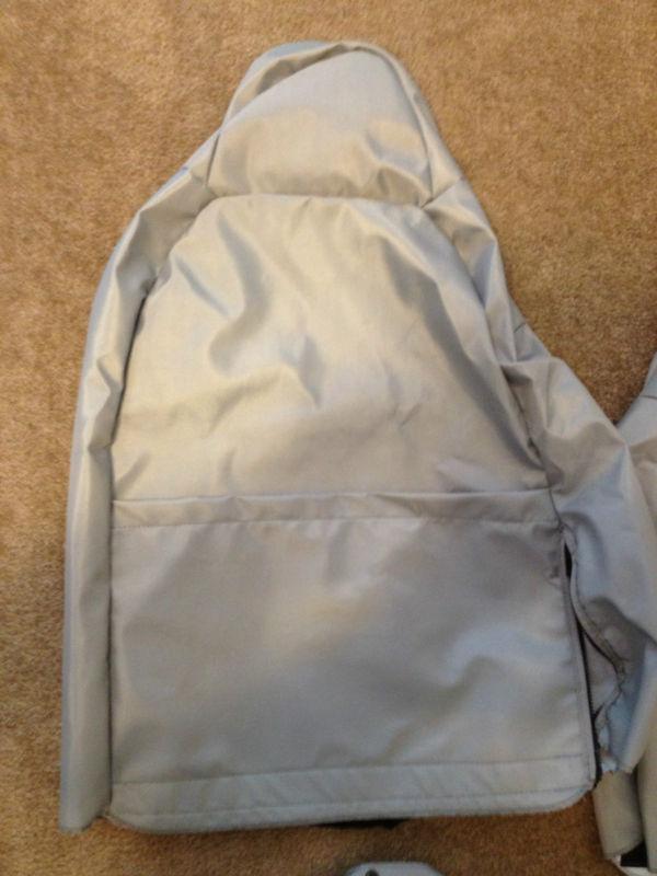 Two custom light gray ballistic bucket seat covers