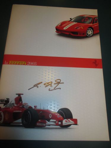 La ferrari annual 2003 brochure signed by michael schumacher