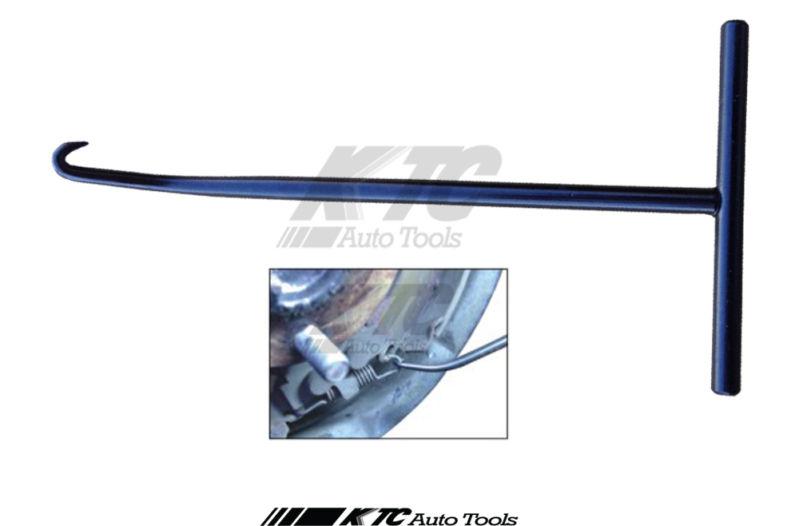 Brake spring and headlight adjusting hook