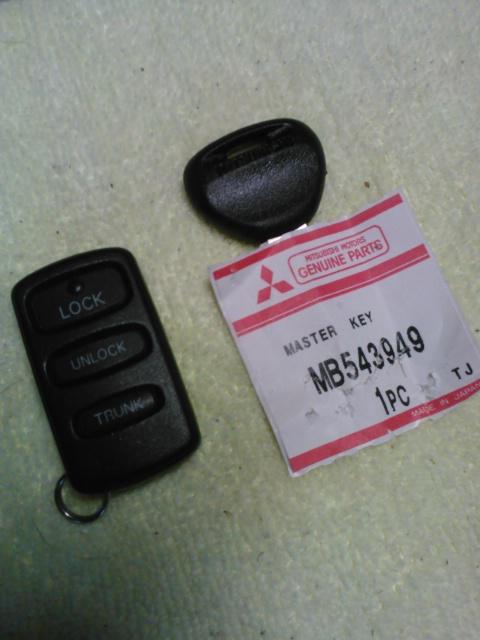 Used mitsubishi remote keyless entry fob with new master key blank (bonas)