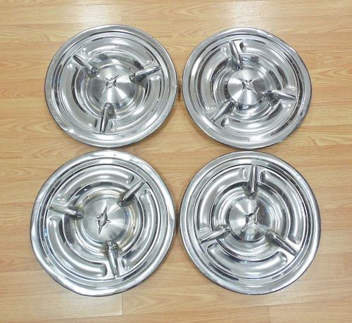 Set of 4 1957 oldsmobile spinner hubcaps wheel covers chrome