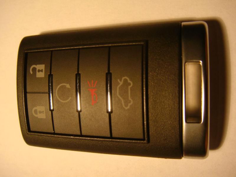 1 oem cadillac dts-cts remote fob 5 button w/start memory 1 ouc6000066