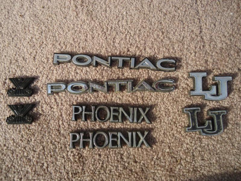  pontiac phoenix lj emblem set lot oem gm fender quarter badge moulding trim