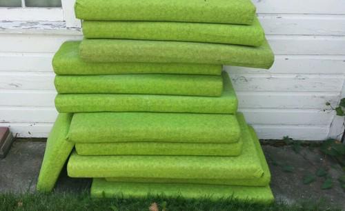 12-gently used pop up camper cushions in fair condition brown underneath green