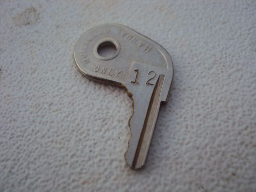 Omc evinrude johnson oem key # 12 stamped. series 73 pistol grip  1973 to 1977