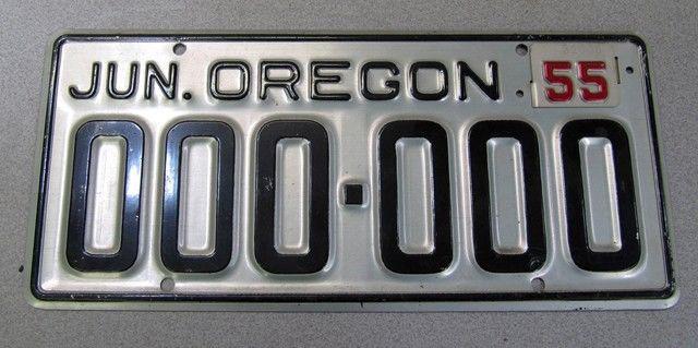 1955 oregon sample license plate with 1955 tag black on silver. rare & very nice