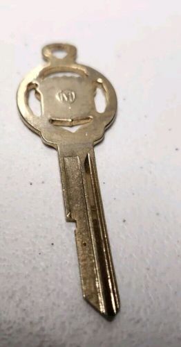 Vintage cadillac gold plated crest 'm' key blank