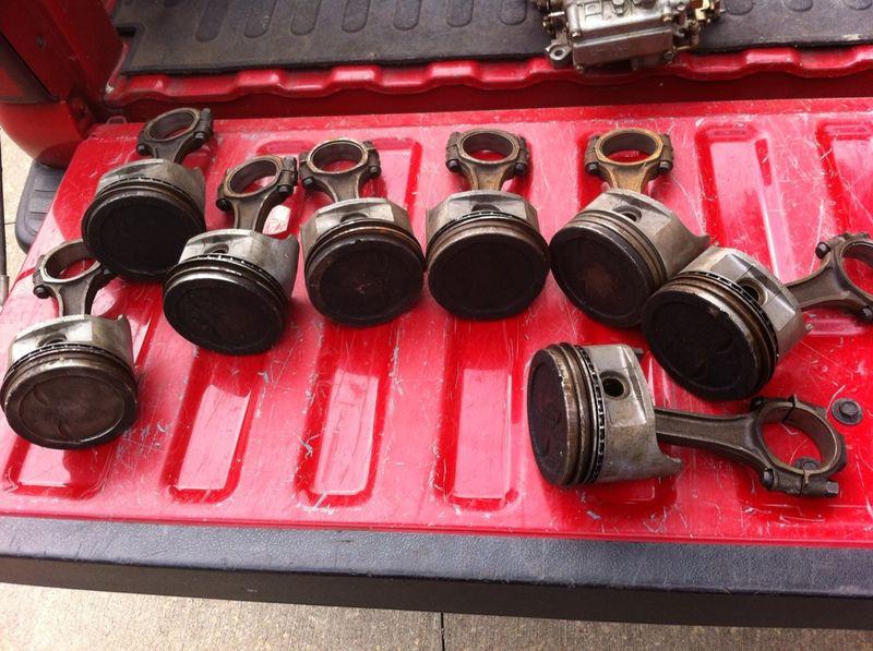 327 pistons (dished) and rods. great shape and low mileage original