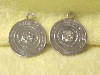 Cadillac " silver  " key chain disc's [2] 1990's gold key delivery--used orig