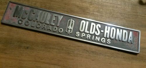 Mccauley--olds--honda--colorado springs-- metal  dealer emblem car  vintage