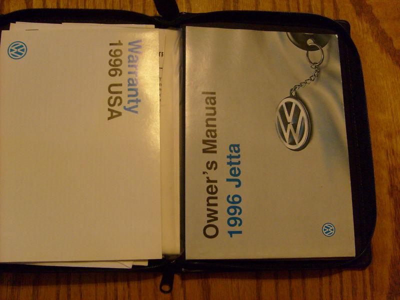 Owners manual in leather pouch & dealer booklet.  1996 vw jetta.