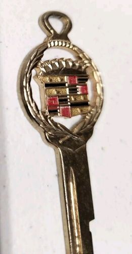 Vintage cadillac gold plated crest 'l'  key blank