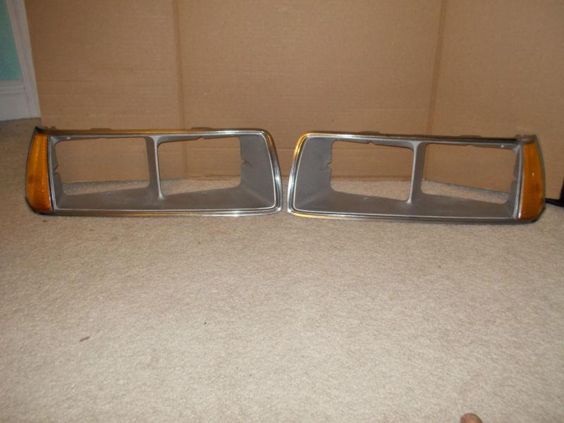 83-86 mercury cougar driver & passenger side headlight bezel assembly.