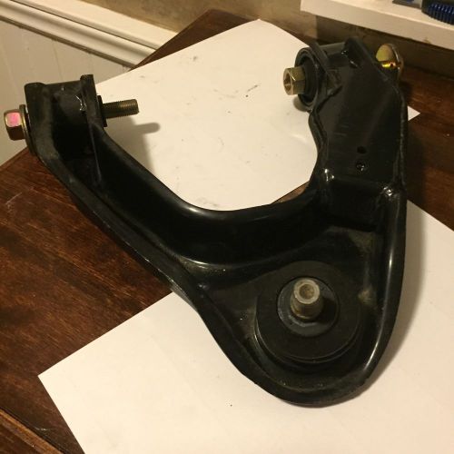Sell Nissan Frontier LEFT Side Upper Control Arm. Plus 2 Cam Bolts in