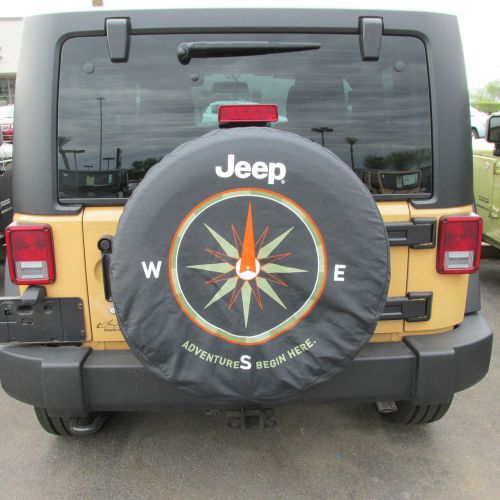 Jeep wrangler &#034;the adventure begins here&#034; logo spare tire cover new oem mopar