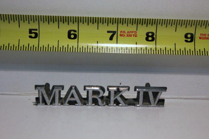 Old car emblem " mark 4 "  removed from junked car many years ago