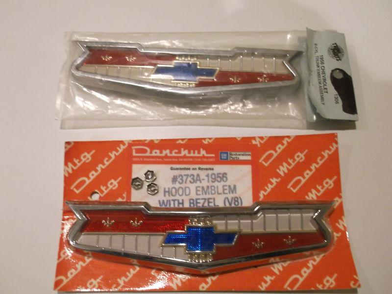 1956- chevy new  front & rear emblems with bezel for 8 cylinder
