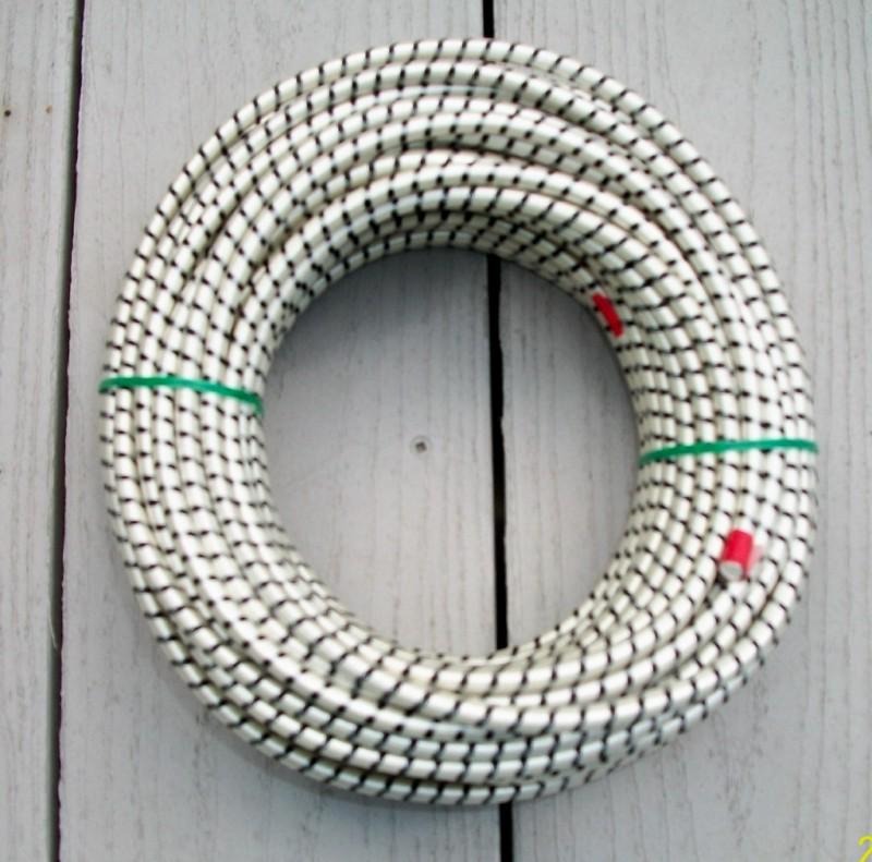100 ft x 1/4" (soiled !!! from storage )nylon cover (bungee) made in usa !!!