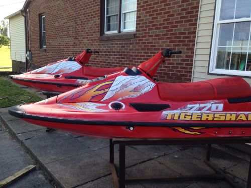 2 arctic cat daytona 770 jet skis with stands. parts only.