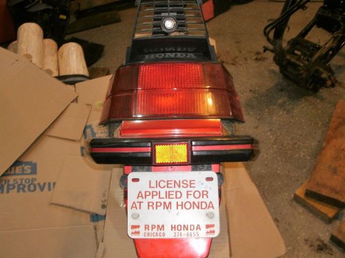 1986 honda elite ch150 rear taillight assembly w/ bumper &amp; license plate holder