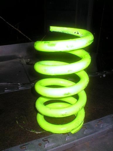 Front spring 1550# 5" dia. 9" height, ground flat one end nascar imca racing