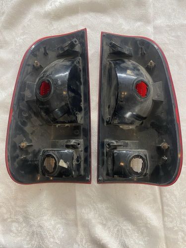 Ford f250 &amp; f350 oem 1997-2003 right &amp; left rear tail light cover assemblies
