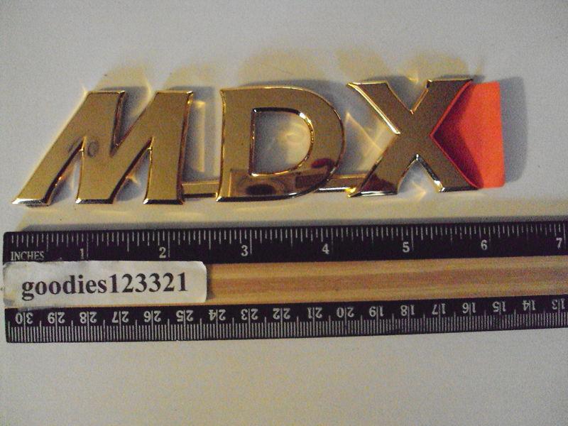 Mazda gold emblem 6" x  1 1/2"