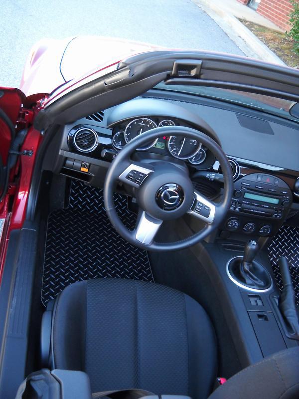 Find Miata MX5 aluminum floor mats. Black with exposed metal diamond