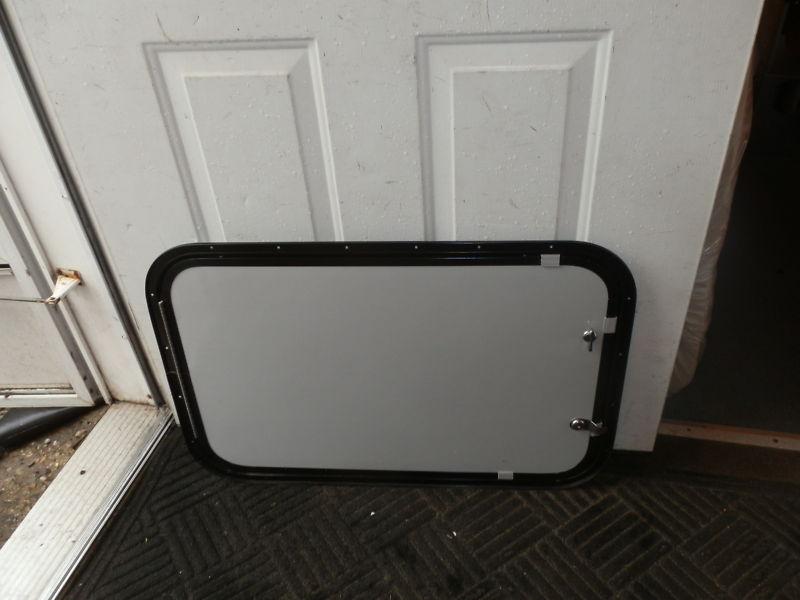 Rv cargo door r.o. 28" tall x 18" wide x 3/4" thick grey/black ( used )