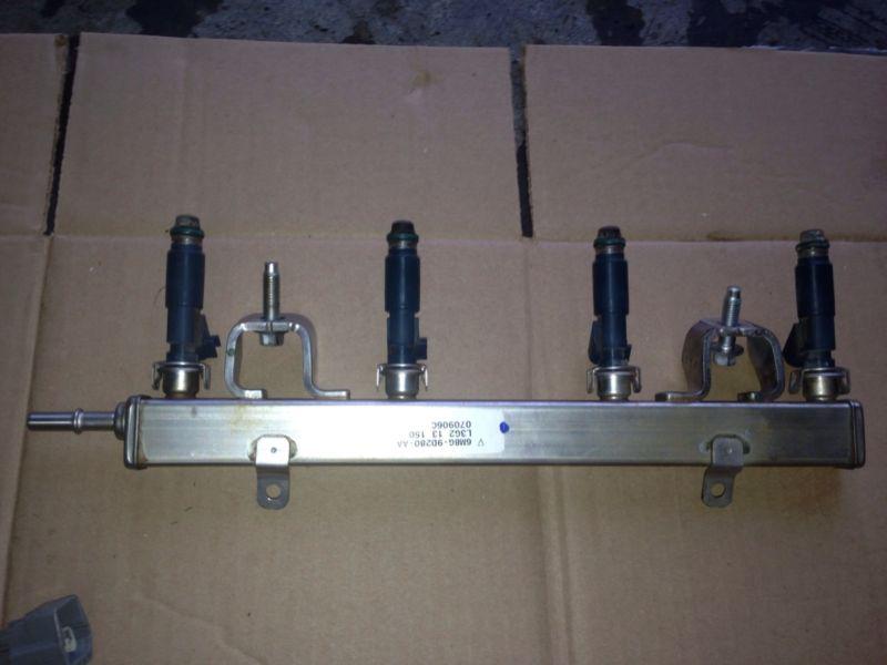 2004 - 2008 mazda 3 2.3l engine rail fuel injector  whit harness