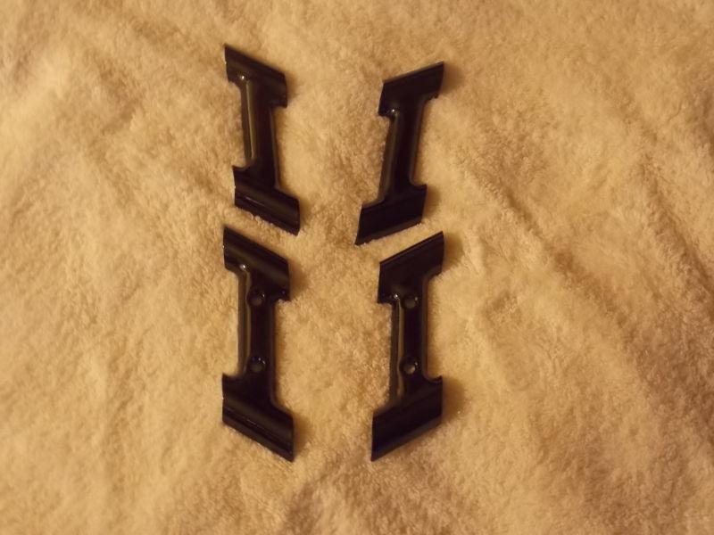 Gloss black powdercoated harley rail spacers-clamps