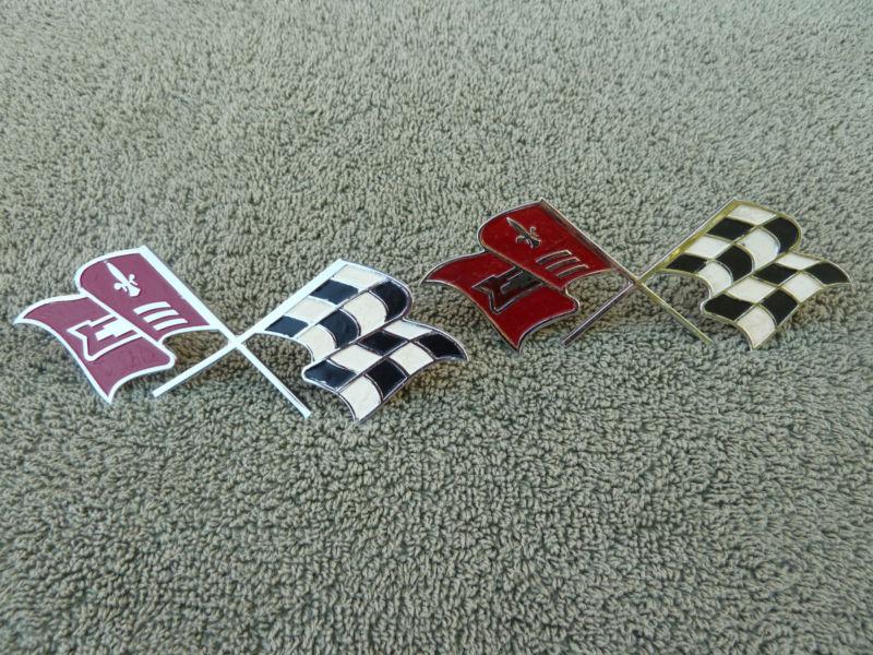 2 1957 - 1960 corvette emblem cross flag emblem stamped # 3767507 nos original  