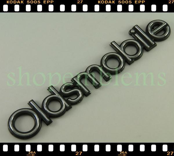 Olds custom cruiser trunk door ornament  badge emblem 91-92 oem nameplate rear