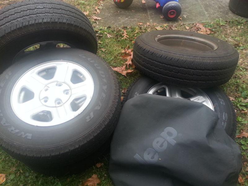 5 goodyear wrangler  tires and jeep rims 