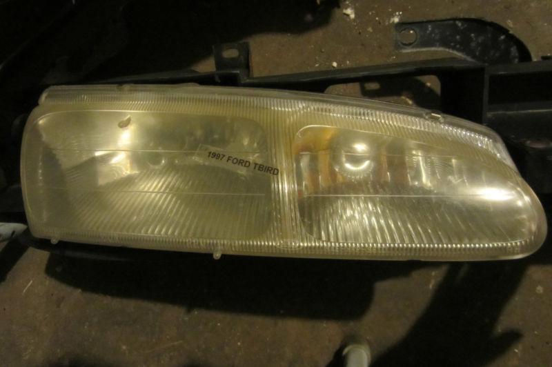 96 97 ford thunderbird  cougar passenger side headlight 