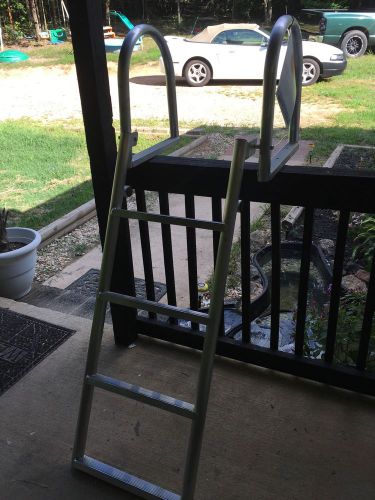 Aluminum 4 step dock full folding ladder.