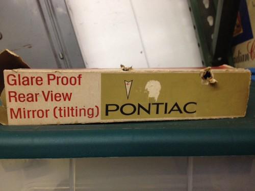 Old pontiac rear view mirror in box