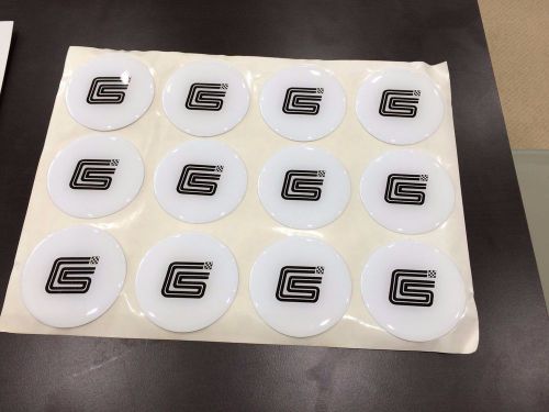 A 12 pc sheet white shelby hub cap stickers for shelby dodge&#039;s in the 1980&#039;s
