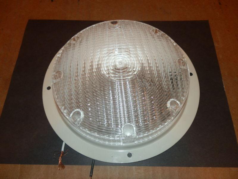 12 volt round light color: white ( used )