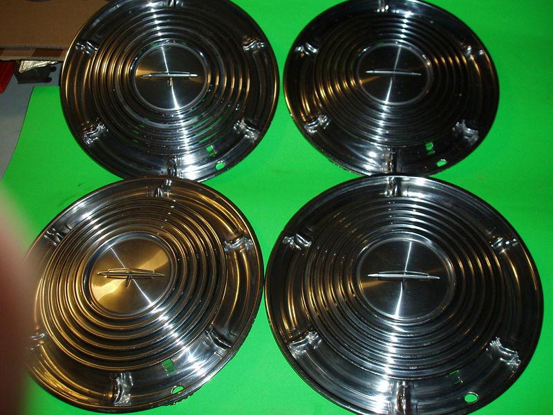 1964 oldsmobile olds n.o.s. nos 14" v-8 hubcaps no paint-just gleaming stainless