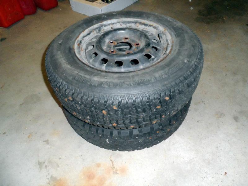Pair of p195/70r14 studded snow tires, used, mounted on rims, 90% tread 