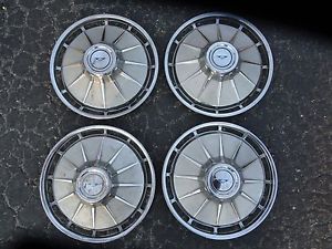 Set of 4 vintage 1961 1962  13 inch chevrolet corvair hubcaps