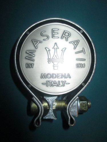 Masersti 100 years - cento anni mmedallion set inside a vintage exhaust pipe