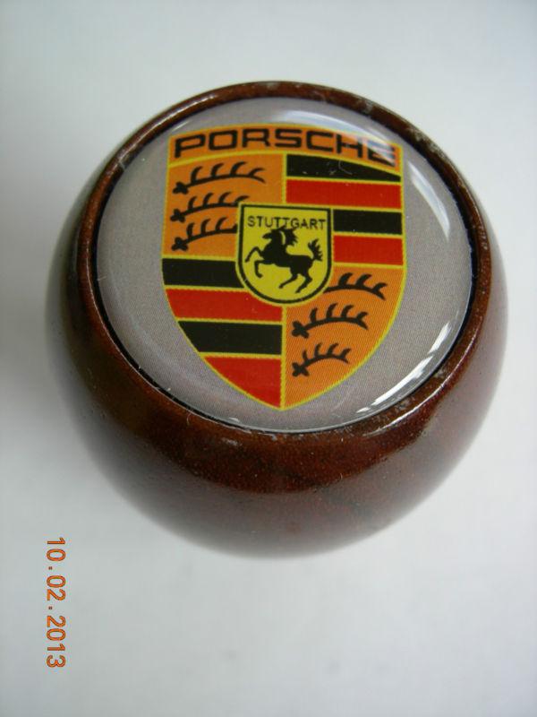 Gear shift knob wood porsche with gray background