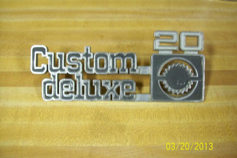1973-76 chevrolet pickup fender emblem (custom deluxe 20) oem