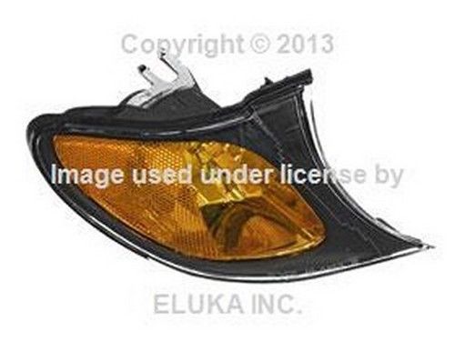 Bmw oem turn signal light with yellow lens and black trim front right e46