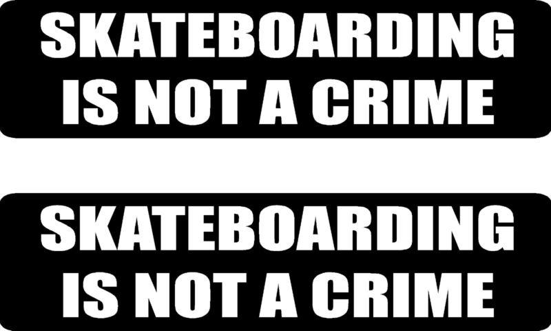 Skateboarding ia not a crime .... 2 funny vinyl bumper stickers (#at1072)