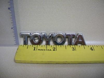 Toyota emblem script symbol logo oem chrome used