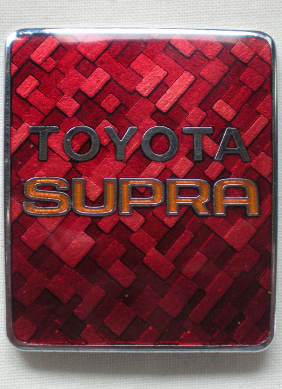 1980s toyota supra oem hood badge trim