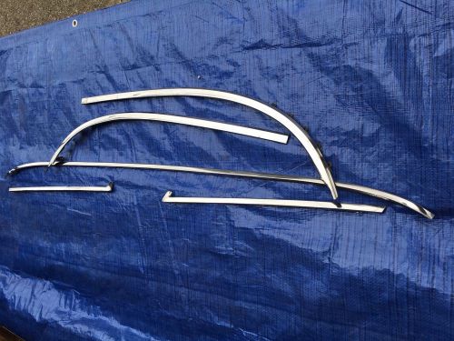 1963 pontiac original windshield outer stainless moldings.